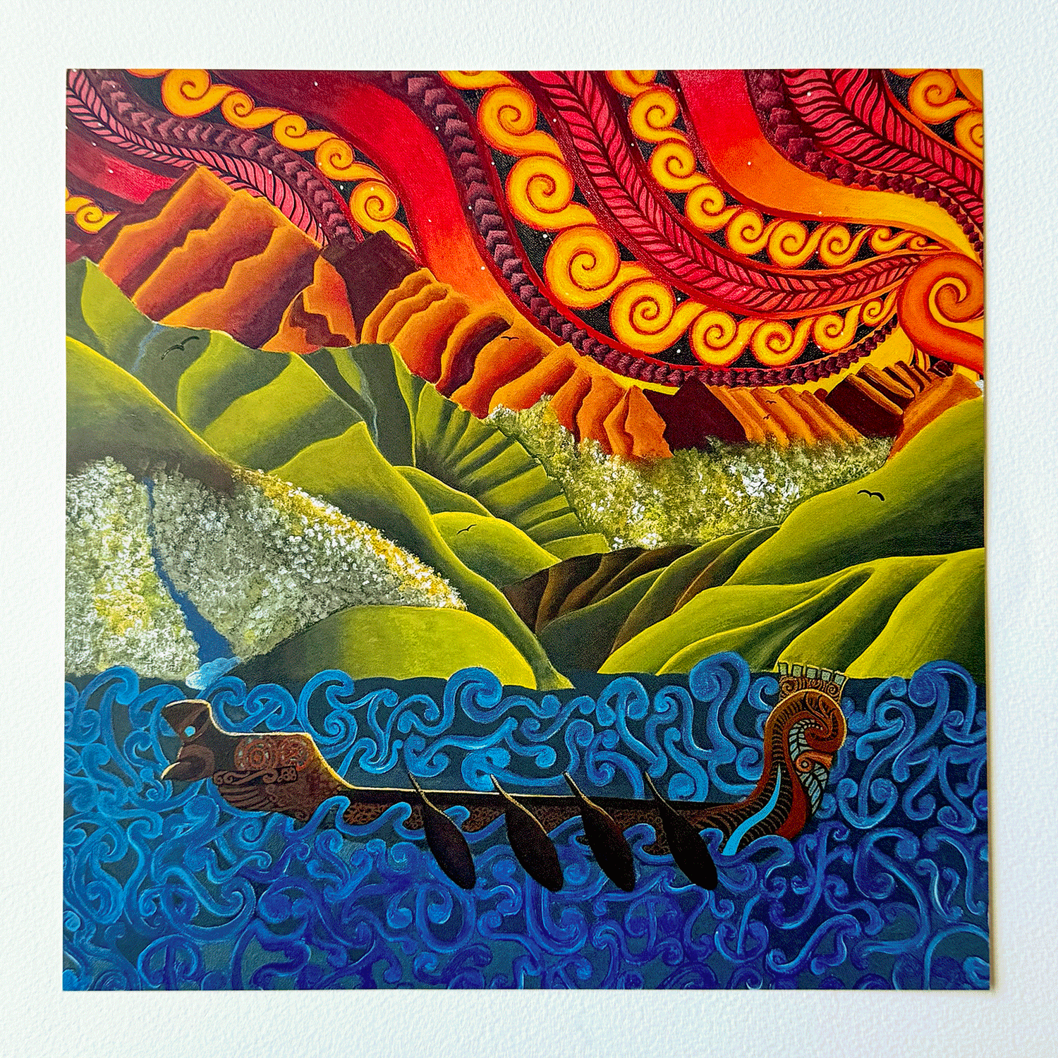 A colorful square painting depicting a stylized landscape with green hills, a blue wavy sea, and a dramatic red and orange sky with swirling patterns. A long boat with figures appears in the lower portion.